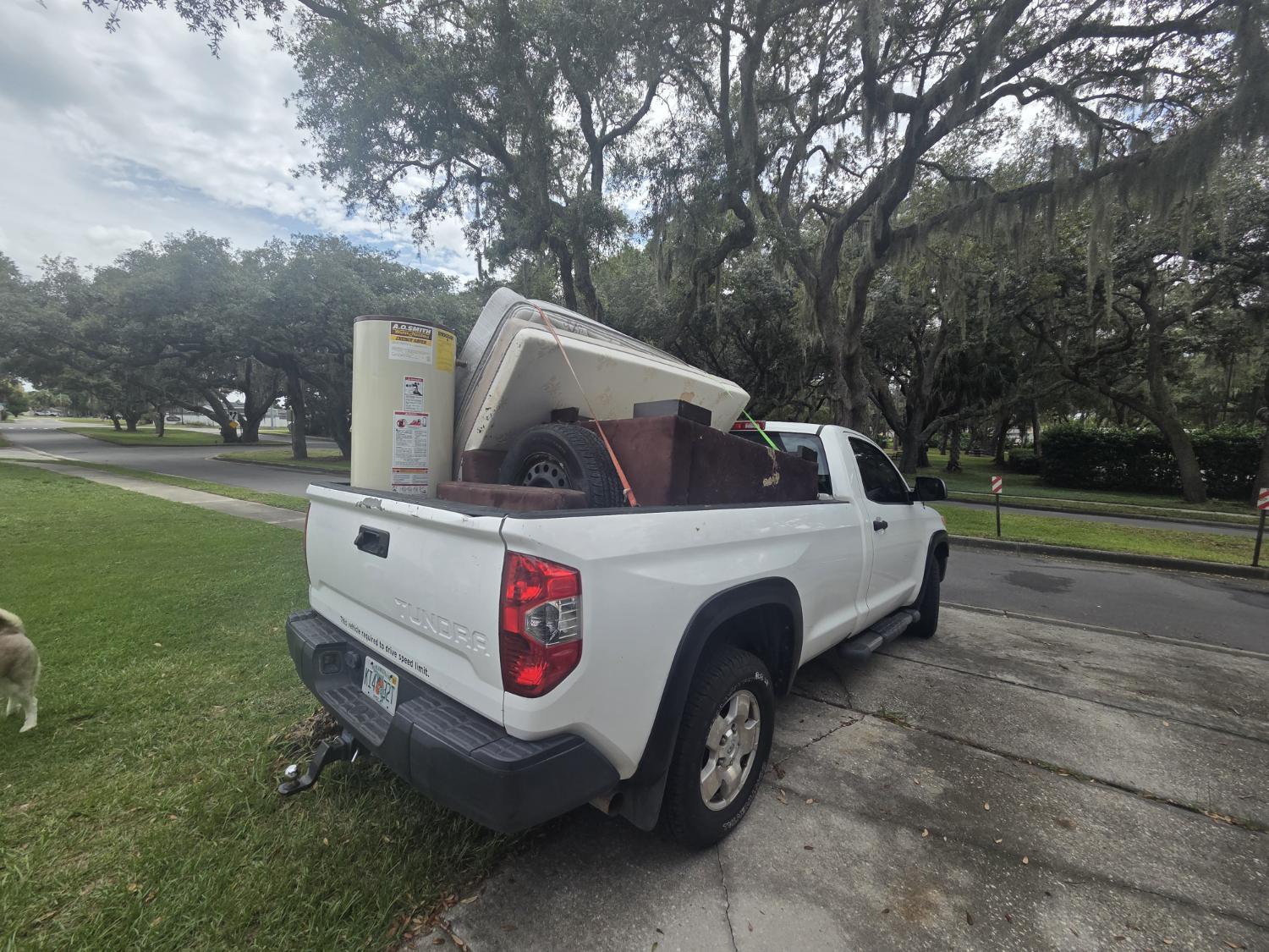 JunkItCheap truck loaded with junk ready for removal